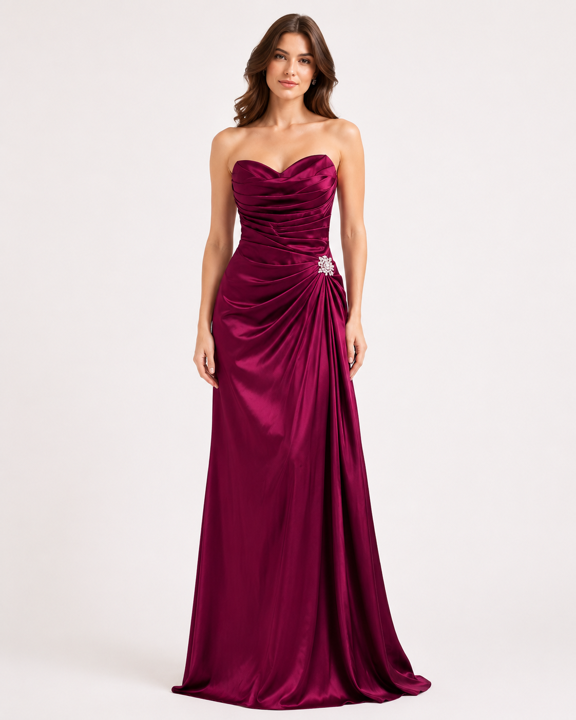 Magenta satin ruched mermaid gown with sweetheart neckline and crystal brooch