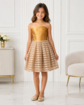 Girl in gold satin strapless bodice with striped champagne organza pleated skirt